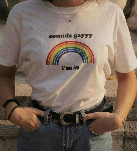 White t-shirt with a rainbow and the words "sounds gay, I'm in"