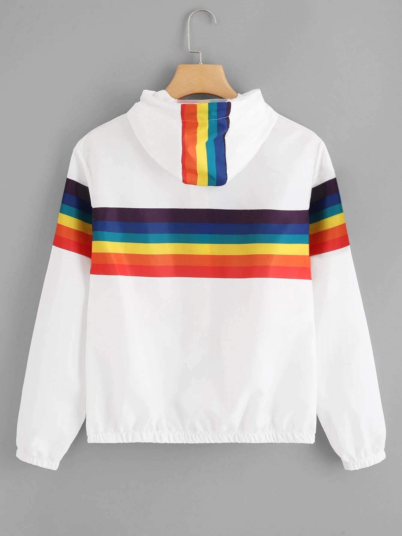 White windbreaker with rainbow across the back and sleeves